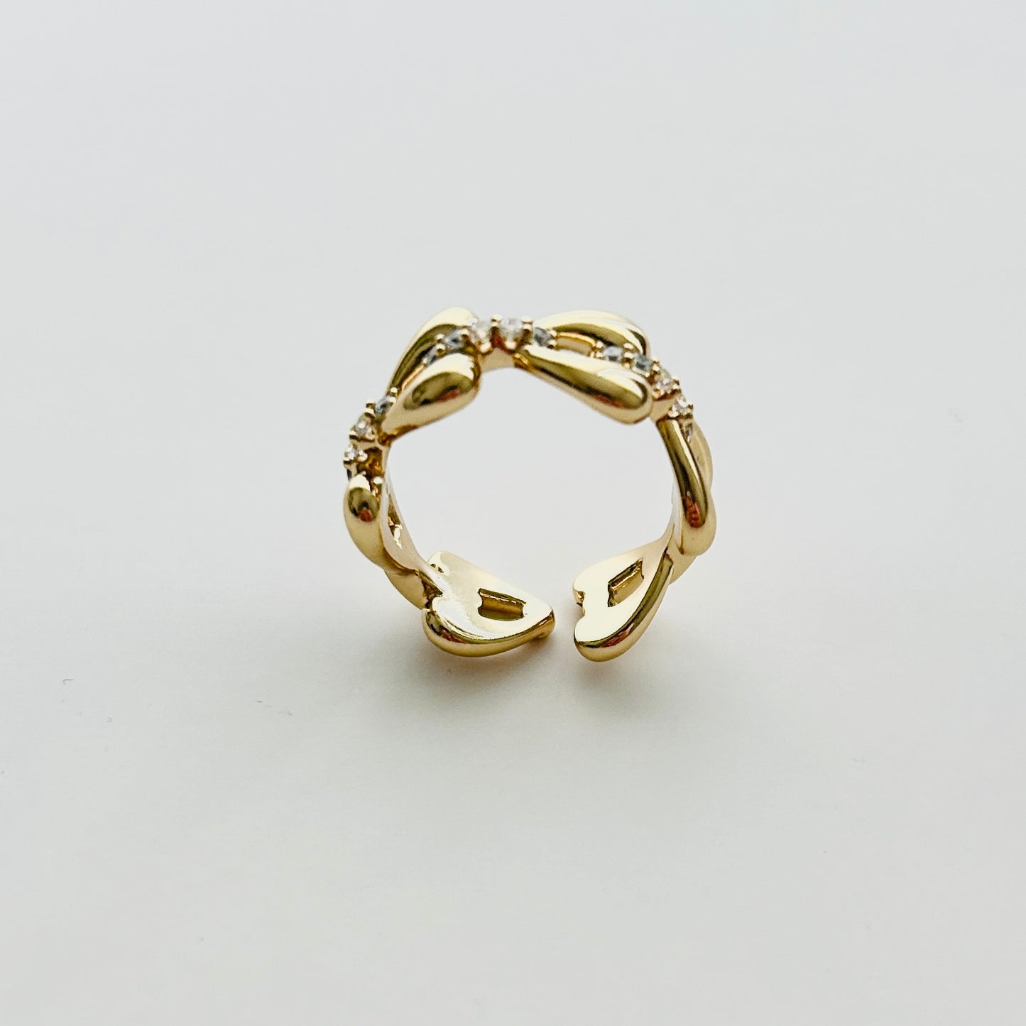 Luxury Adjustable Gold-Plated Ring with Heart Motifs and Sparkling Cubic Zirconia