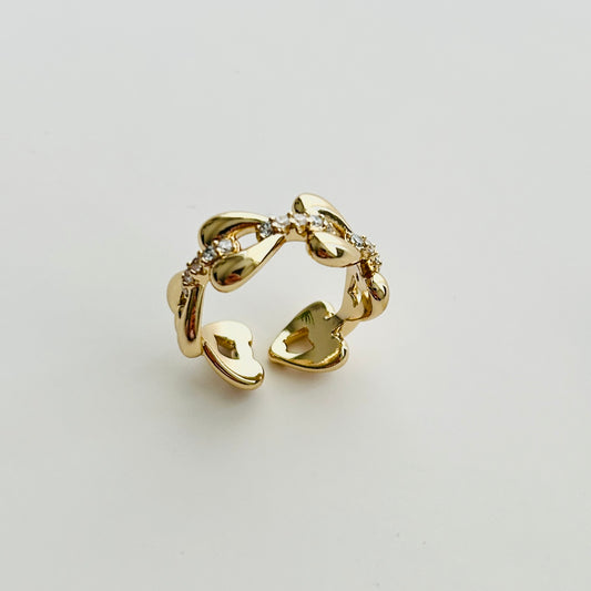 Luxury Adjustable Gold-Plated Ring with Heart Motifs and Sparkling Cubic Zirconia