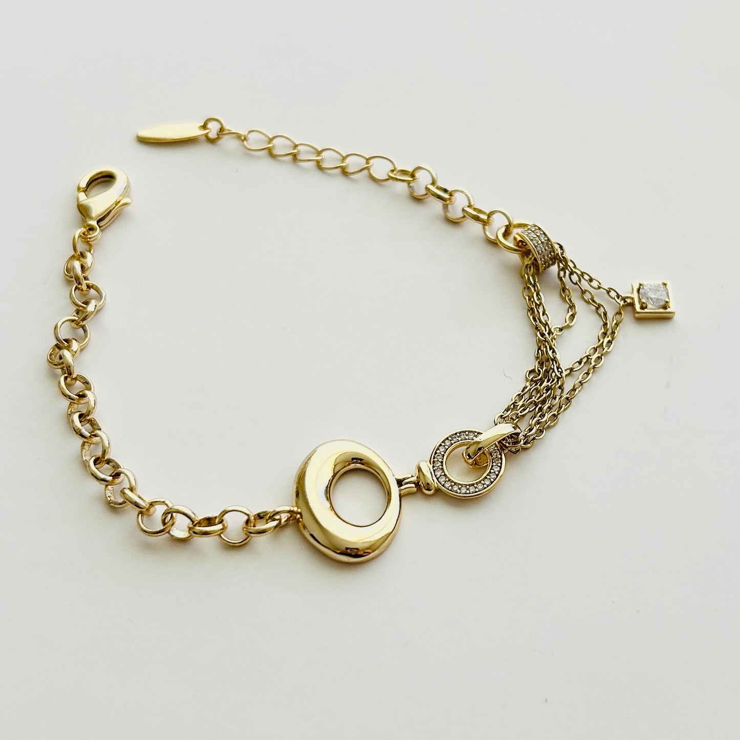 Gold Charm Bracelet with Elegant Details